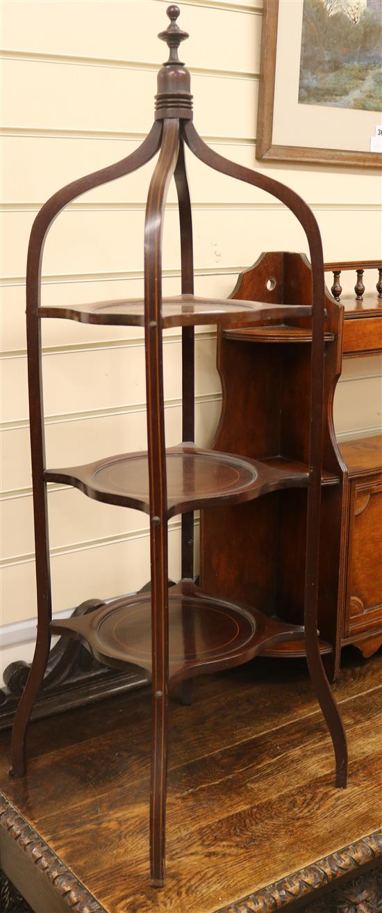 An Edwardian inlaid mahogany three tier cake stand W.33cm